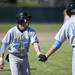 Skyline High School junior Justin Woods celebrates scoring a run with teammate Jack Clark during a double header against Chelsea on Monday, April 22. Daniel Brenner I AnnArbor.com
